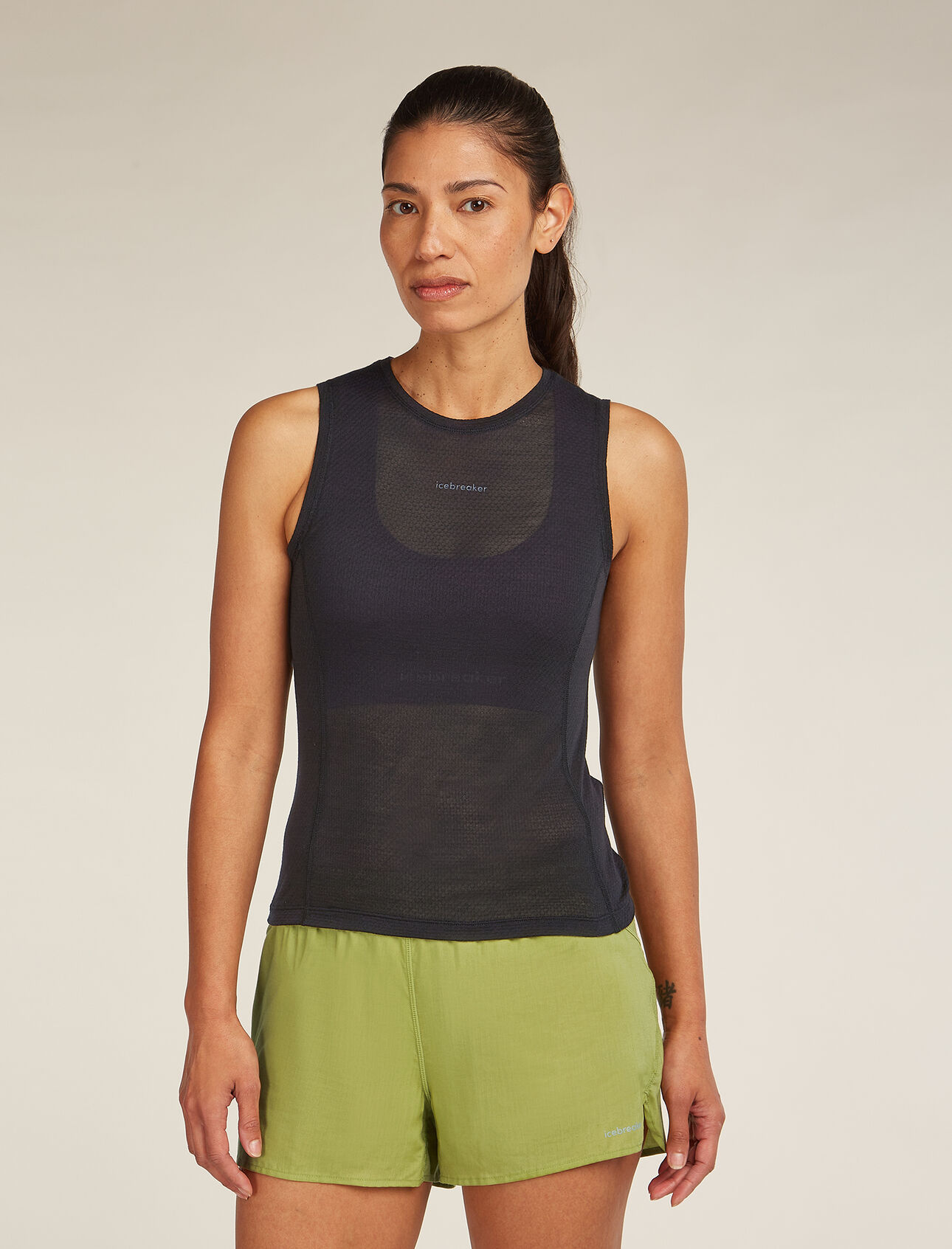 Womens Merino Blend 75 Cool-Lite™ Featherlight™ Tank  Slim Fit  – Tailored performance fit, shorter in length. Size up for regular fit.       Featuring an ultra-lightweight eyelet mesh of breathable TENCEL™ Lyocell and merino wool blend that dries quickly and helps to keep you cool, the Merino Blend 75 Cool-Lite™ Featherlight™ Tank offers versatile, all-season performance with its shorter hem and performance cut.