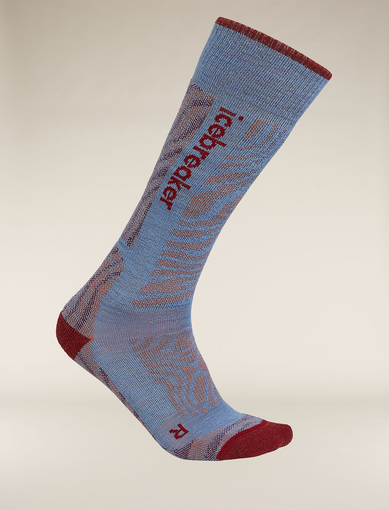 Womens Merino Blend Ski+ Medium Over The Calf Socks Mountain Contour Fully cushioned ski socks for skiing the resort or the backcountry,  the Merino Blend Ski+ Medium Over the Calf Mountain Contour socks are made with a durable, breathable merino wool blend. The all-over print draws inspiration from the intricate patterns of a mountain's elevation lines.