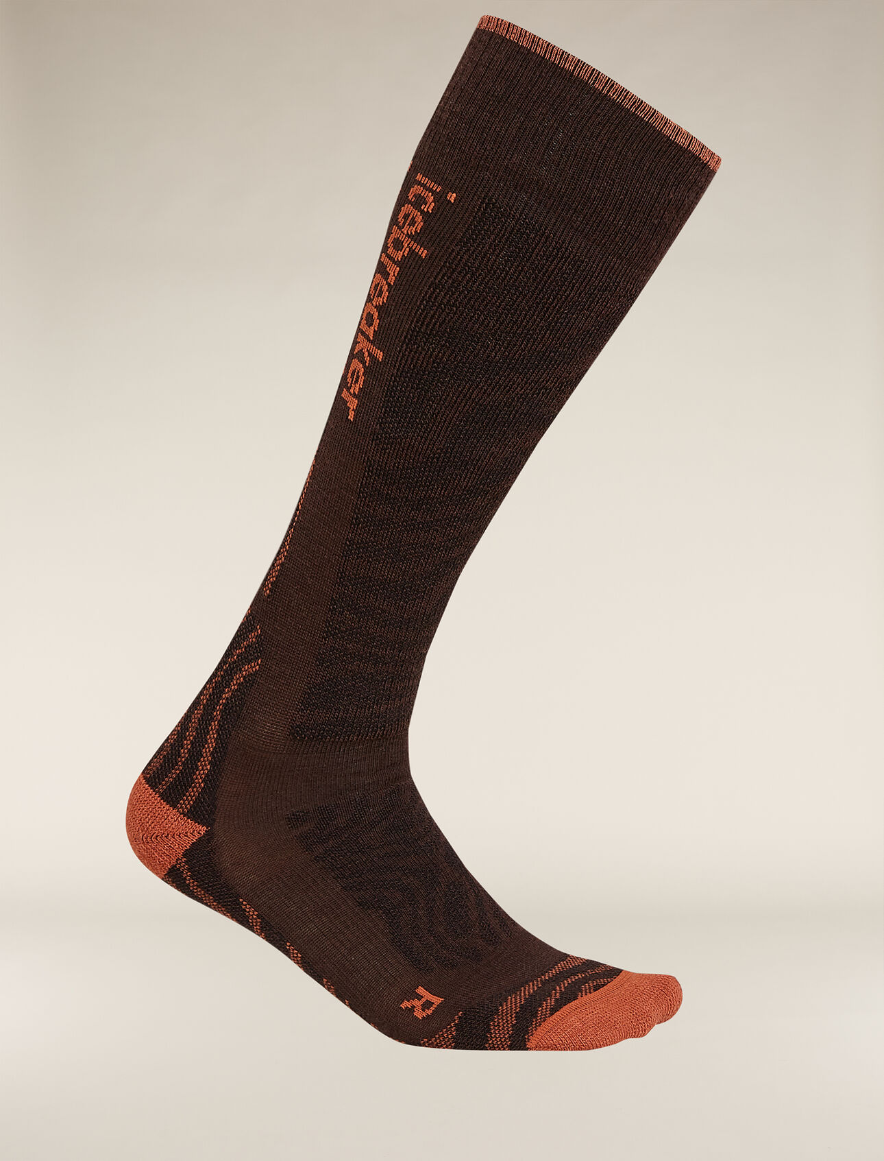 Womens Merino Blend Ski+ Medium Over The Calf Socks Mountain Contour Fully cushioned ski socks for skiing the resort or the backcountry,  the Merino Blend Ski+ Medium Over the Calf Mountain Contour socks are made with a durable, breathable merino wool blend. The all-over print draws inspiration from the intricate patterns of a mountain's elevation lines.