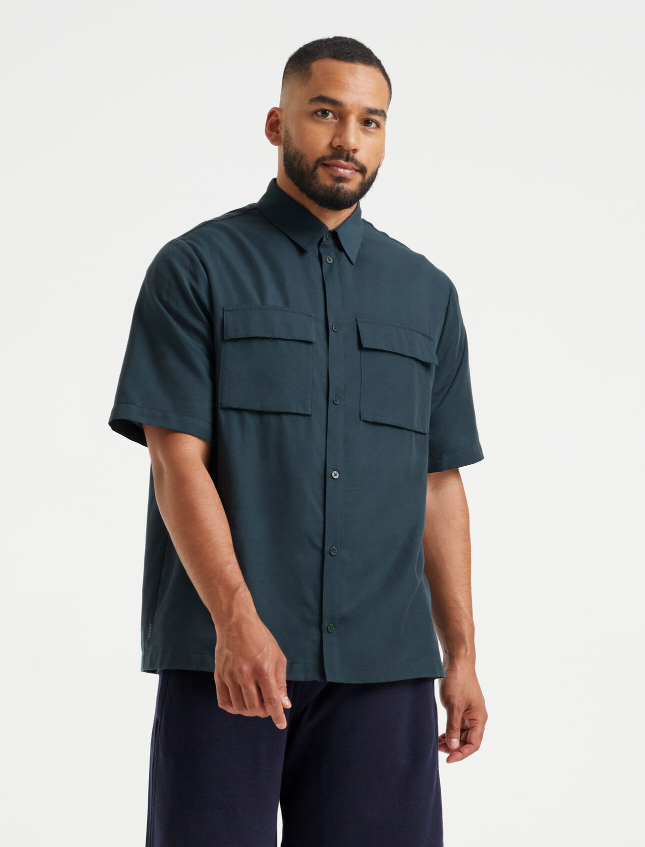 Mens Merino Natural Blend Short Sleeve Double Pocket Shirt An ultra-lightweight shirt made from our breathable Cool-Lite™ woven fabric, the Merino Natural Blend Short Sleeve Double Pocket Shirt offerscool comfort with modern style.