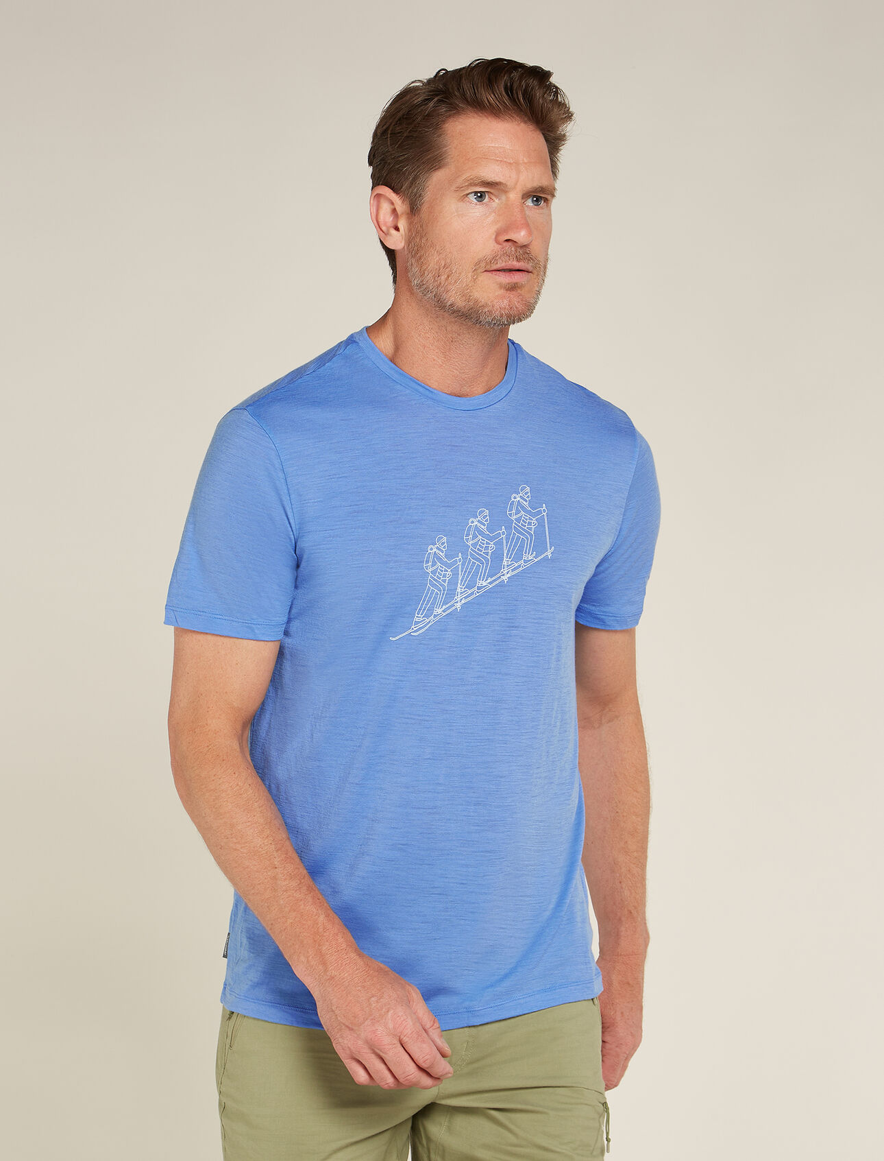 Mens Merino 150 Tech Lite Short Sleeve T-Shirt Natural Ski Tour Our most versatile tech tee that provides comfort, breathability and odour-resistance for four seasons worth of adventure, the Merino 150 Tech Lite Short Sleeve Tee Natural Ski Tour features 100% merino for all-natural performance. The unique graphic artwork features an illustration of the single-file life on the skin track. 