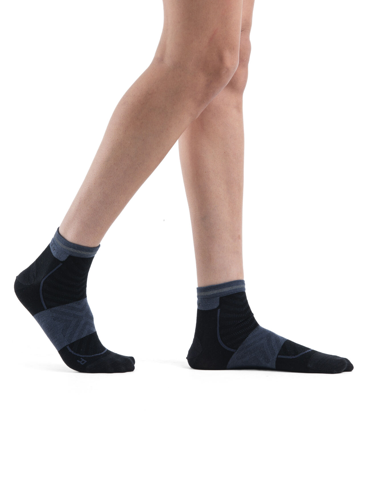 Womens Merino Blend Run+ Ultralight Mini Socks Thin, ultralight running socks made with a technical merino wool blend and low-cut height, the Merino Run+ Ultralight Mini is perfect for runs of any length. A reflective stripe on the back helps keep you visible in low-light conditions.