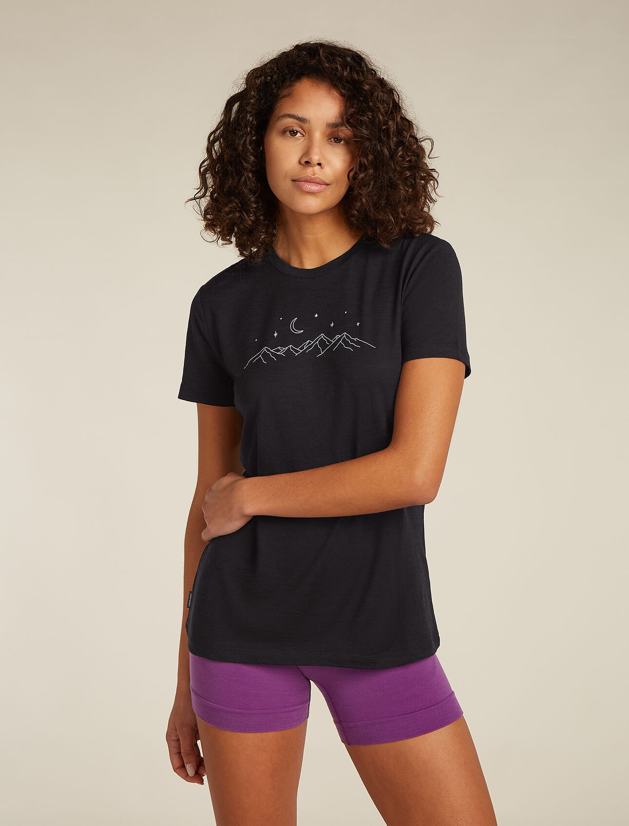 Womens Merino 150 Tech Lite Short Sleeve T-Shirt Sparkling Stars Our most versatile tech tee that provides comfort, breathability and odour-resistance for four seasons worth of adventure, the Merino 150 Tech Lite Short Sleeve Tee Sparkling Stars features 100% merino wool fabric for all-natural performance. The original graphic artwork features an illustration of a twinkling night sky over a majestic mountain range. 
